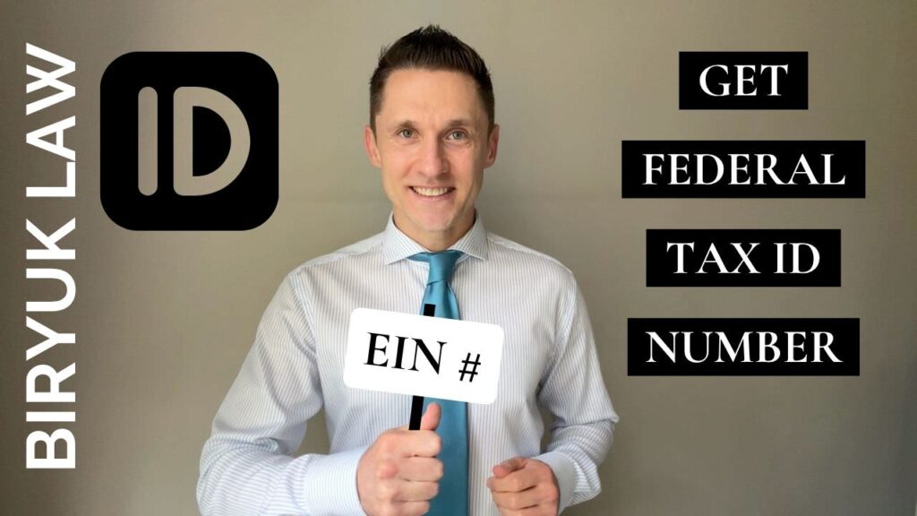 Photo of Dmytro Biryuk holding a sign showing EIN number