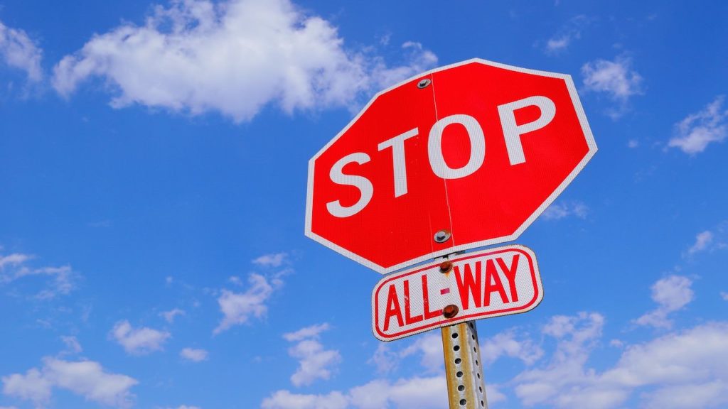 Image of a stop sign indicating a legal due diligence showstopper in an M&A deal